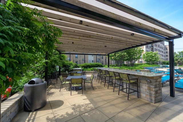 view of patio / terrace with a pergola, an outdoor bar, and central air condition unit