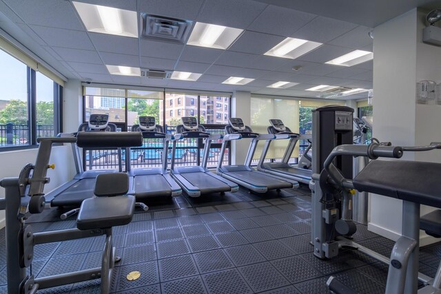 exercise room with a paneled ceiling