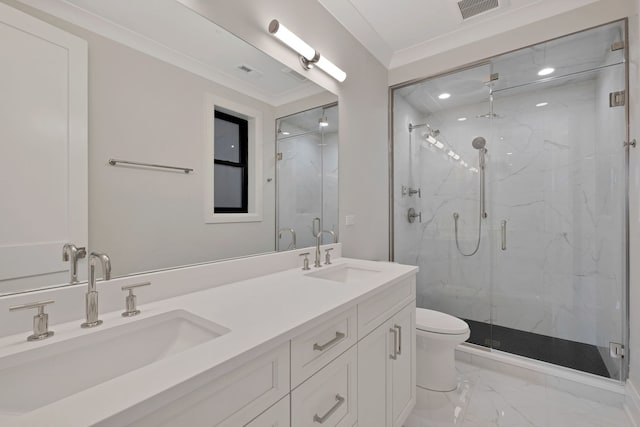 bathroom featuring crown molding, toilet, vanity, and a shower with shower door