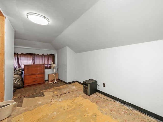additional living space featuring lofted ceiling