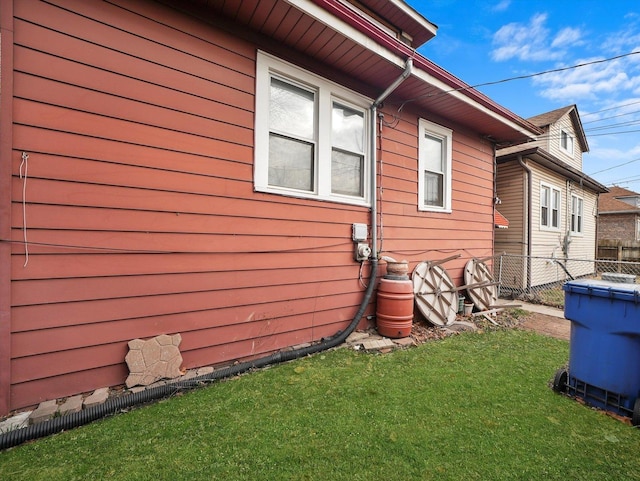 view of home's exterior with a lawn