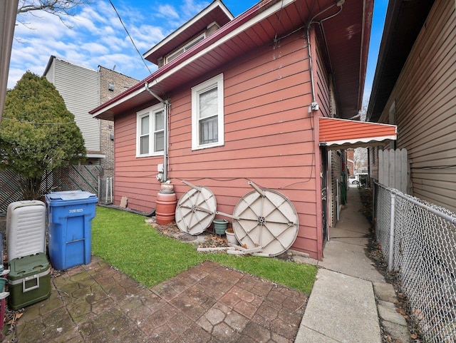 view of side of home featuring a patio
