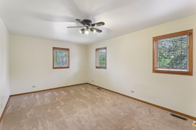 4204 E Dr, Wonder Lake, IL 60097 - spare room with light colored carpet and a ceiling fan