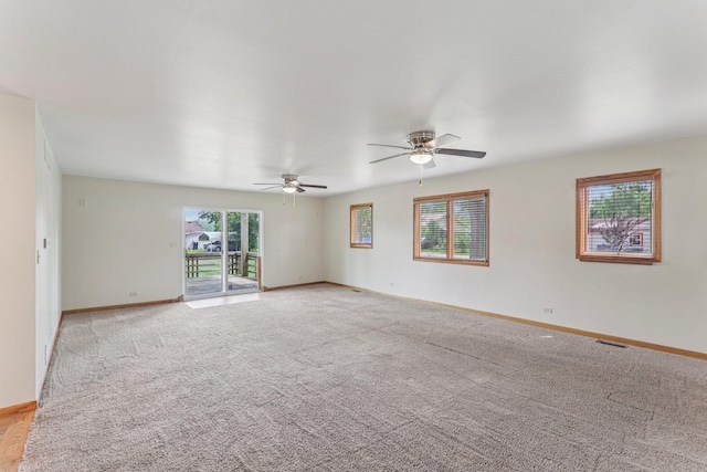4204 E Dr, Wonder Lake, IL 60097 - empty room with a ceiling fan and light colored carpet