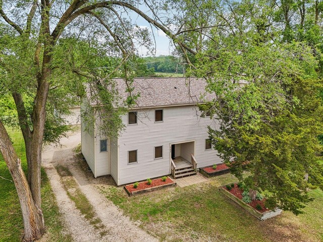 4204 E Dr, Wonder Lake, IL 60097 - rear view of house featuring dirt driveway and a shingled roof