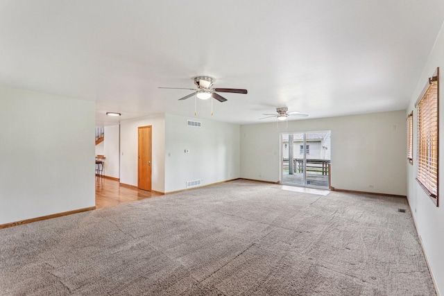 4204 E Dr, Wonder Lake, IL 60097 - unfurnished living room featuring light carpet and ceiling fan