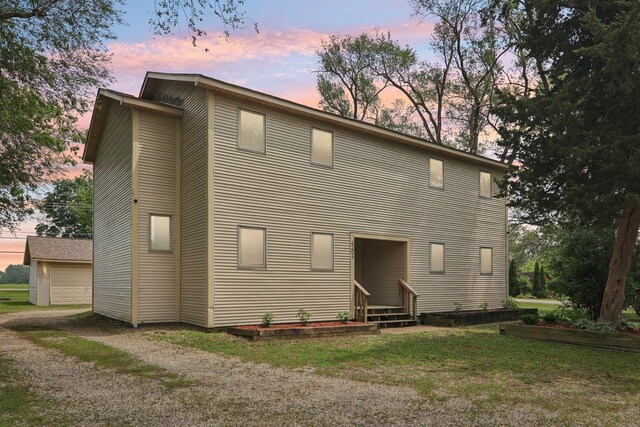 4204 E Dr, Wonder Lake, IL 60097 - back of property at dusk with entry steps and a yard