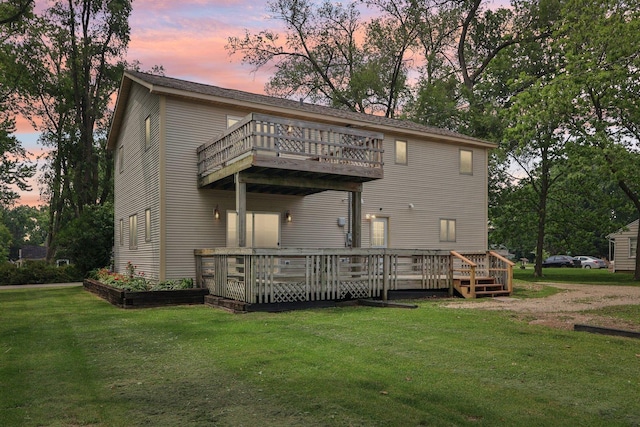 4204 E Dr, Wonder Lake, IL 60097 - rear view of house featuring a yard, a balcony, and a wooden deck