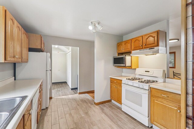 4204 E Dr, Wonder Lake, IL 60097 - kitchen featuring white appliances, under cabinet range hood, light wood-type flooring, and light countertops