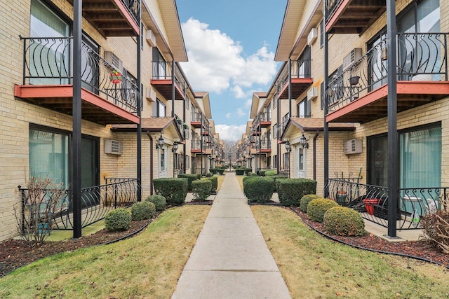 view of property's community with a lawn