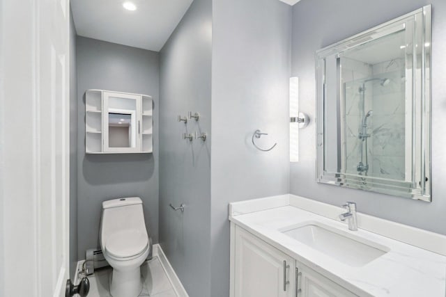 bathroom featuring vanity, a shower with door, and toilet