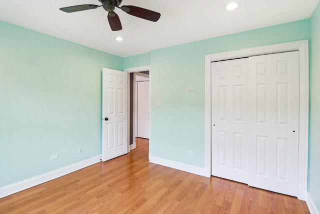 unfurnished bedroom with a closet, ceiling fan, and light hardwood / wood-style flooring