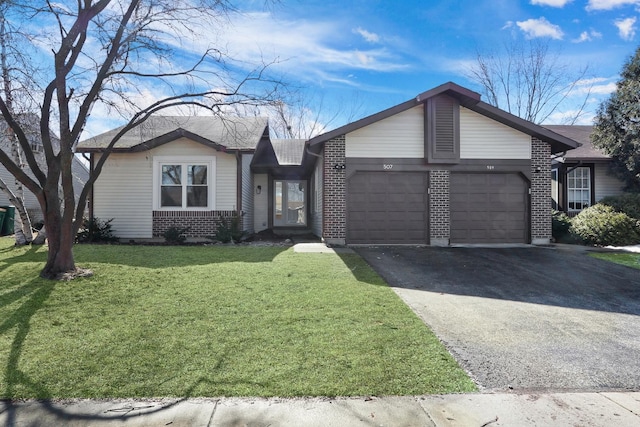 single story home with a garage, brick siding, driveway, and a front lawn