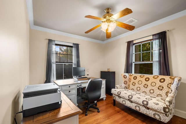 office with crown molding, ceiling fan, light hardwood / wood-style floors, and a wealth of natural light