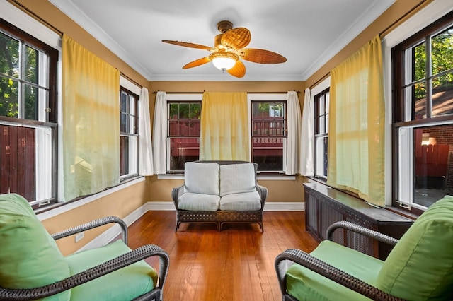 sunroom featuring ceiling fan