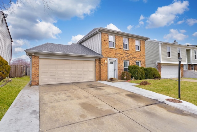 view of front facade with a garage and a front yard