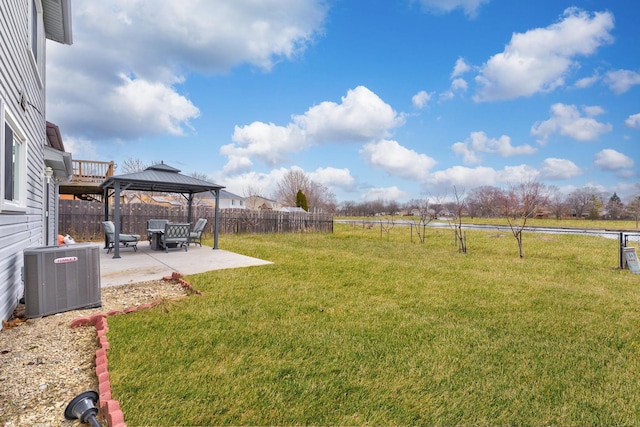 view of yard featuring cooling unit, a gazebo, and a patio