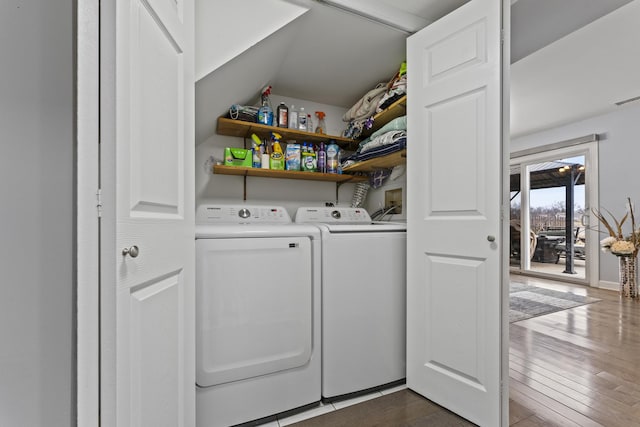 laundry room with dark wood-type flooring and independent washer and dryer