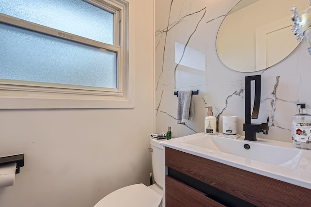 half bath with vanity and toilet