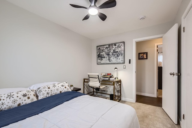 bedroom with carpet, baseboards, and a ceiling fan