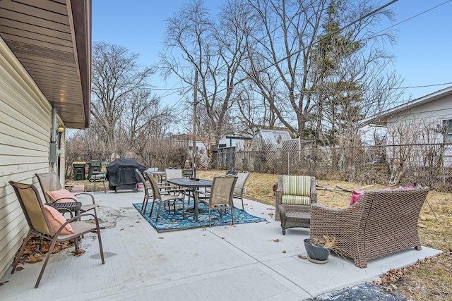 view of patio featuring a fenced backyard, outdoor dining area, and area for grilling