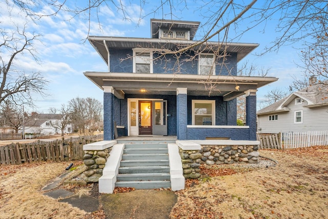 view of front of property featuring covered porch