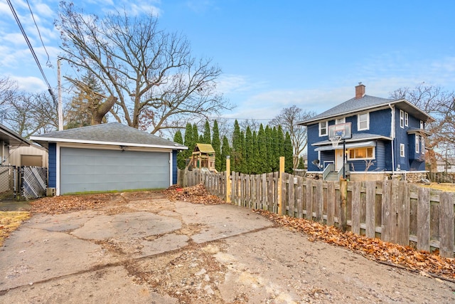 view of side of property with an outbuilding and a garage