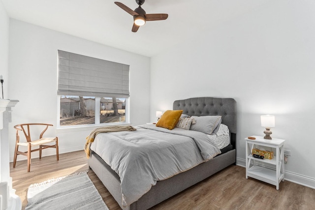 bedroom featuring hardwood / wood-style flooring and ceiling fan