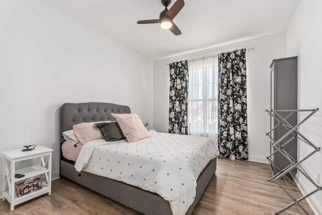 bedroom featuring hardwood / wood-style floors and ceiling fan