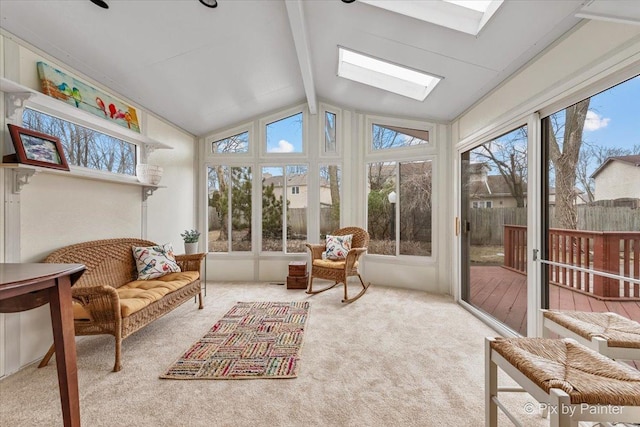 sunroom with vaulted ceiling with skylight