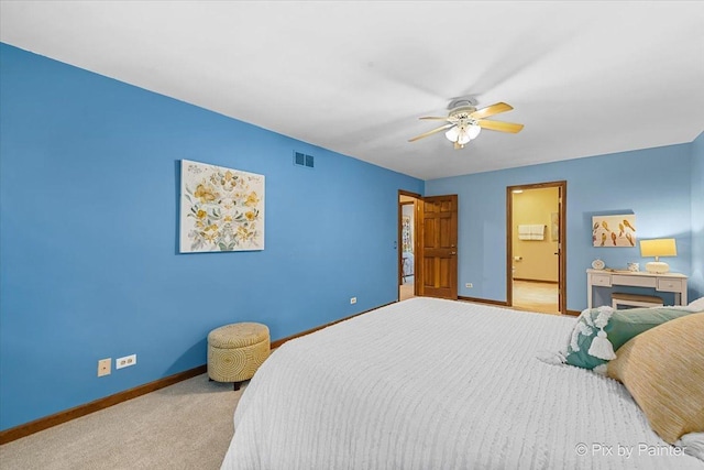 bedroom featuring ceiling fan and light carpet