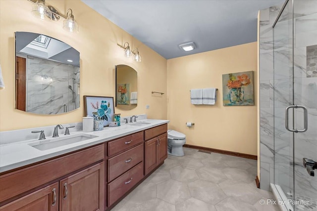 bathroom featuring vanity, toilet, and walk in shower