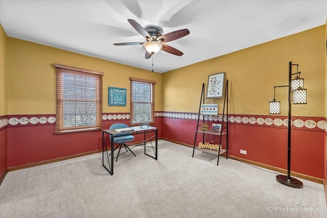 office with light colored carpet and ceiling fan