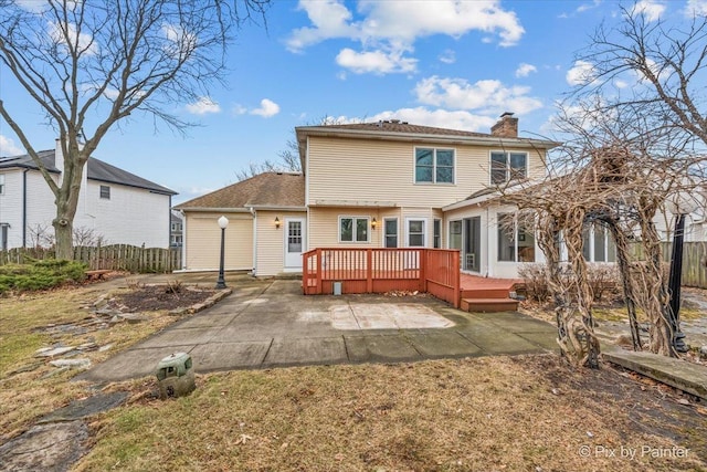 back of house with a patio and a deck