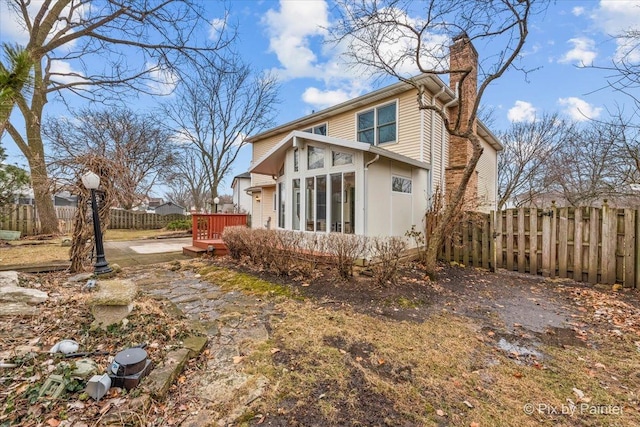 rear view of property with a deck