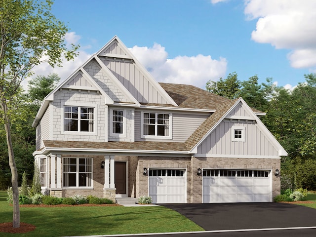 view of front of home featuring a garage and a front lawn