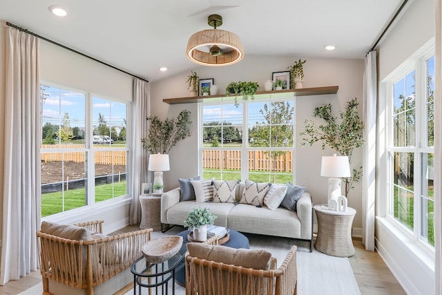 sunroom / solarium featuring lofted ceiling