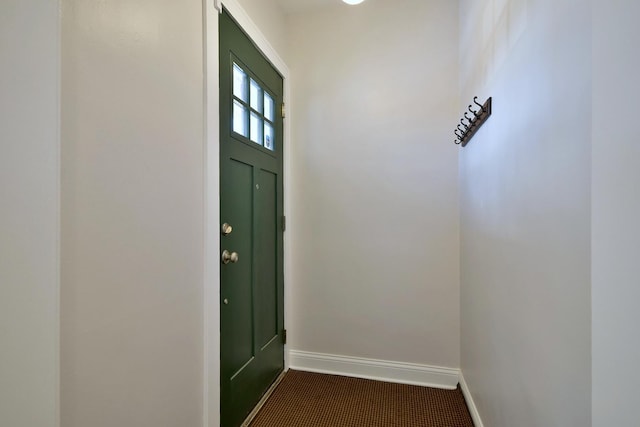 doorway to outside with carpet floors