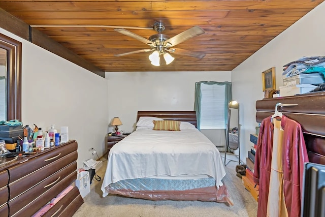 carpeted bedroom featuring ceiling fan and wooden ceiling