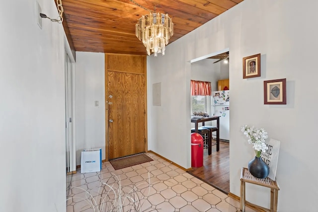 entrance foyer featuring ceiling fan with notable chandelier and wooden ceiling