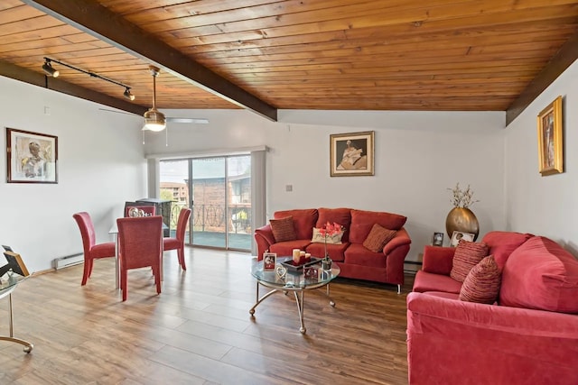 living room featuring rail lighting, vaulted ceiling with beams, wooden ceiling, hardwood / wood-style flooring, and a baseboard heating unit