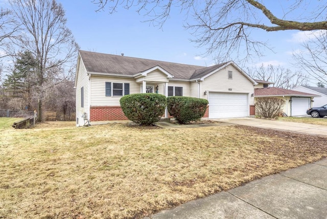 ranch-style home featuring a garage and a front lawn