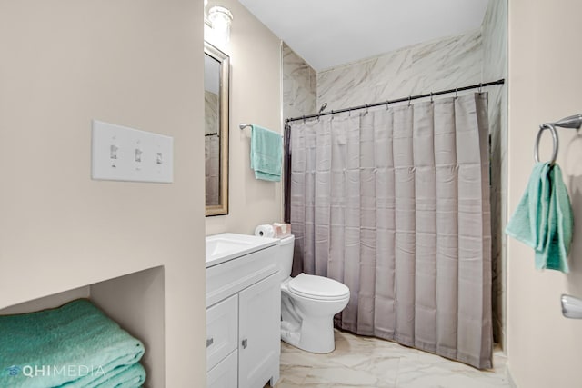 full bathroom with marble finish floor, vanity, and toilet