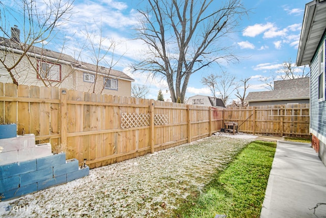 view of yard with a fenced backyard