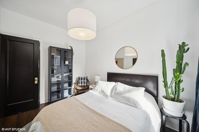 bedroom featuring dark wood-type flooring