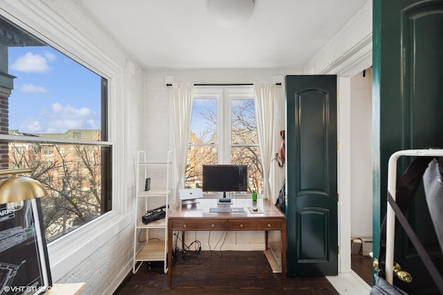 office space featuring a healthy amount of sunlight and dark wood-type flooring