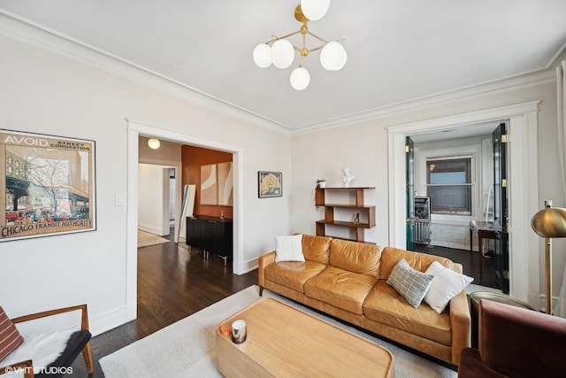 living room featuring dark wood-type flooring and ornamental molding