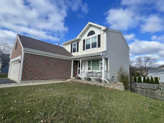 front of property with a garage, a front lawn, and a porch