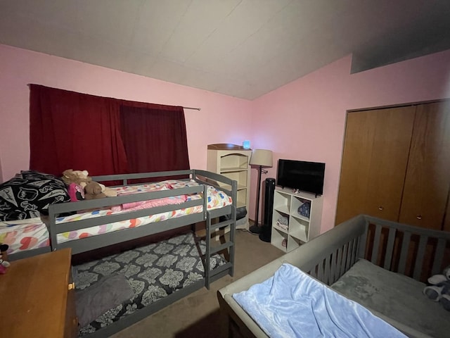 carpeted bedroom with vaulted ceiling