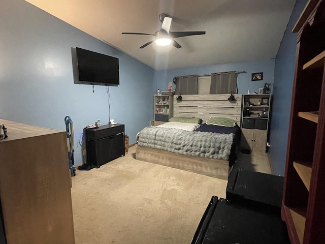 carpeted bedroom with ceiling fan and lofted ceiling